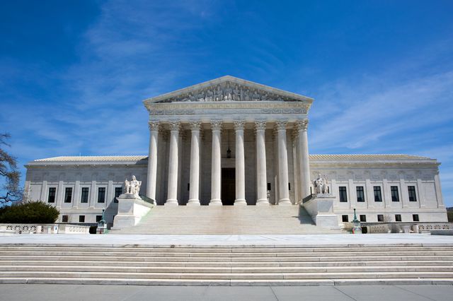 The Supreme Court is seen, with its white neoclassical building and pillars